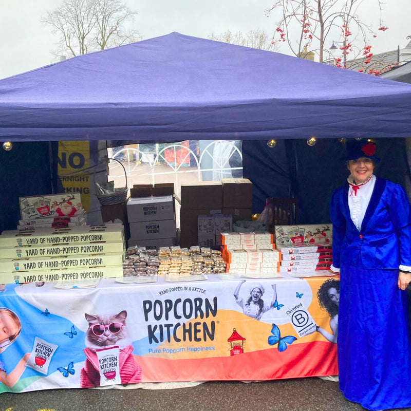 lady dressed in Dickensian costume selling popcorn in Olney