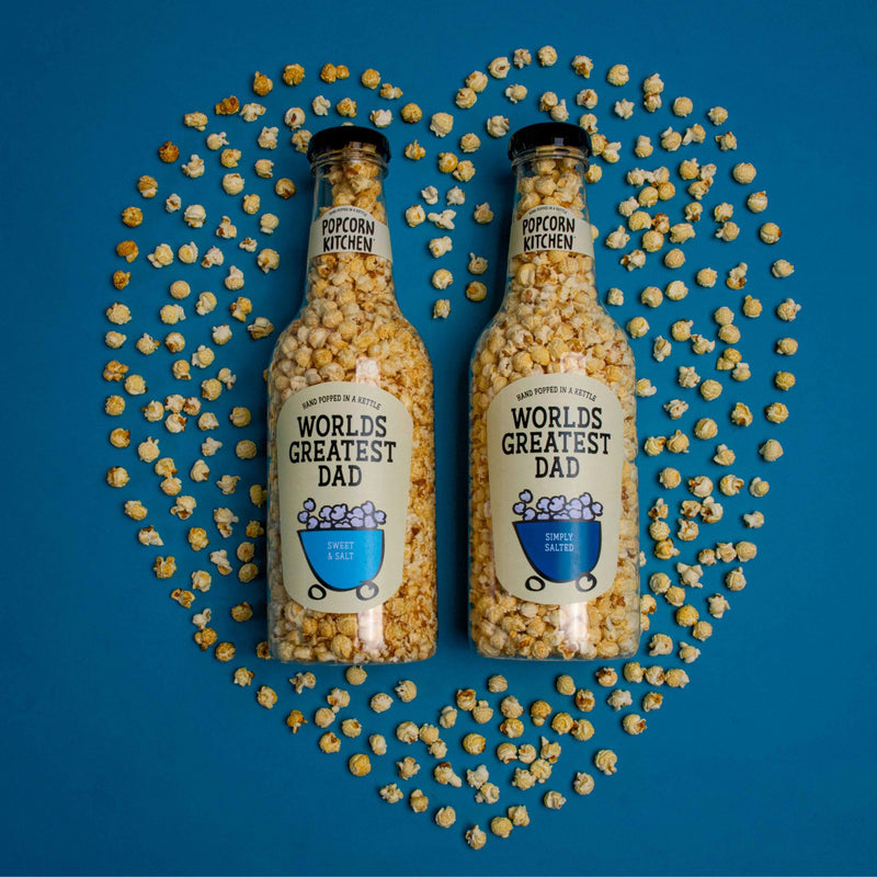 2 Giant bottles of popcorn with worlds greatest dad labels in a popcorn heart