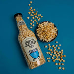 Giant bottle of popcorn with worlds greatest dad label and a bowl of popcorn