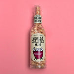 worlds best mum label on a bottle of white chocolate and raspberry popcorn 